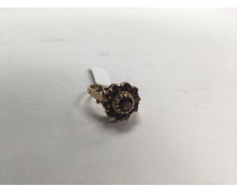 A 1970’s 9ct gold all garnet cluster ring. Weight approx 4g, size approx O.