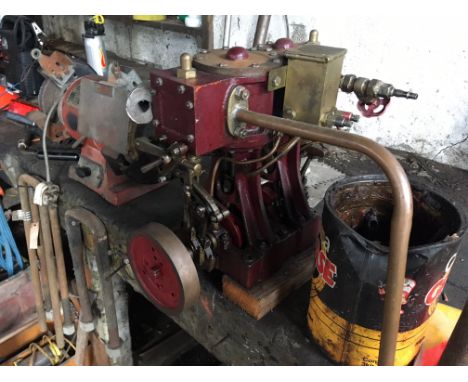 A model live steam twin piston engine possibly for a marine application to be powered  by a steam boiler. Most likely used on