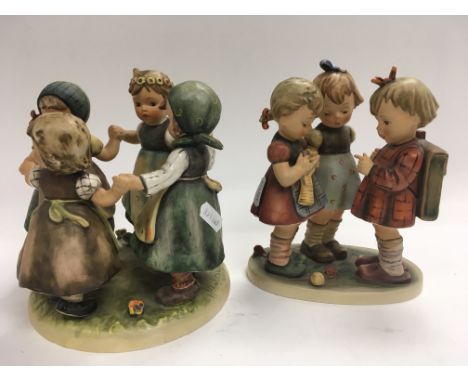 Two Hummel figurines depicting children playing. One damaged.