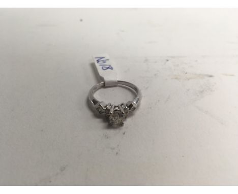 An unusual diamond set ring in platinum. Size approx O, weight approx 4.5g