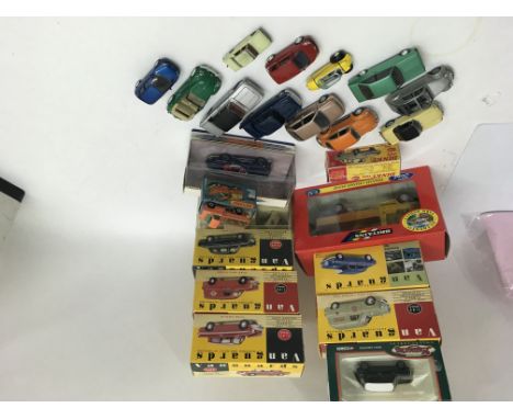 A collection of model vehicles including boxed Vanguards, and unboxed Dinky Toys and others together er with a child's tin pl