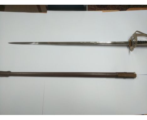 A similar Queen Elizabeth II Wilkinson sword with a leather scabbard.