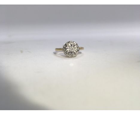 An 18ct yellow and white gold diamond cluster ring. Weight approx 3g, size approx M.