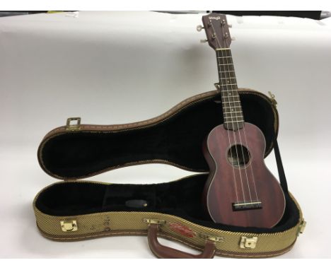 A cased ‘Stagg’ Ukelele.