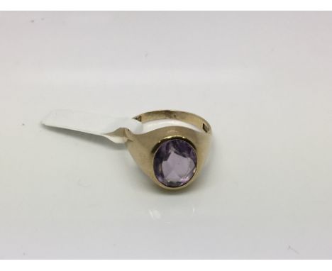 A 9ct gold oval amethyst ring, approx size R-S and approx 6.6g.