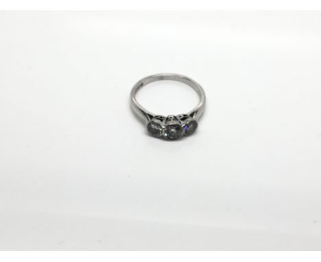 A quality 18 carat white gold Ladies ring set with three brilliant cut diamonds. Ring size N.