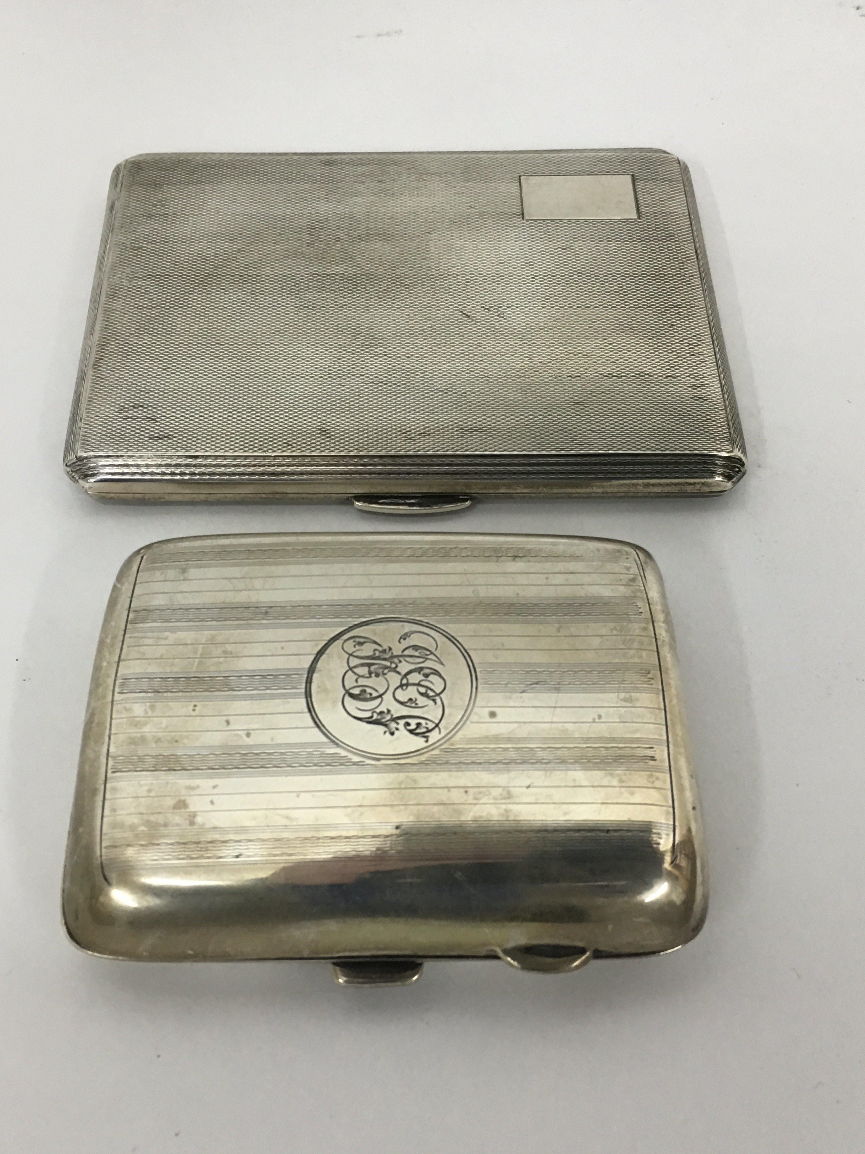 Two silver cigarette cases