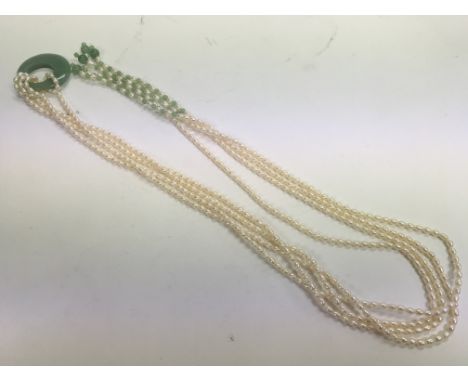 A cultured pearl and jade necklace, length approx 81cm.