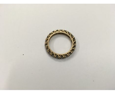 A stone set eternity ring. Size approx O/N Weight approx 4g