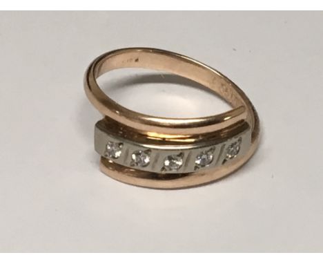 A 14ct Gold ring set with a single row of five diamonds, hallmarks to the outside edge of the ring size R.