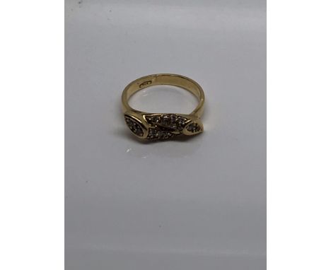 A 18 ct gold ring inset with a cluster of diamonds