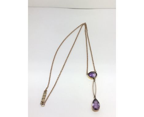 A 9ct yellow gold amethyst drop pendant and chain