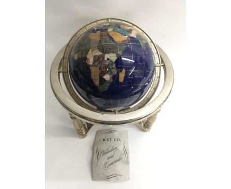 A gem set globe with original box and guarantee.Approx 32cm diameter