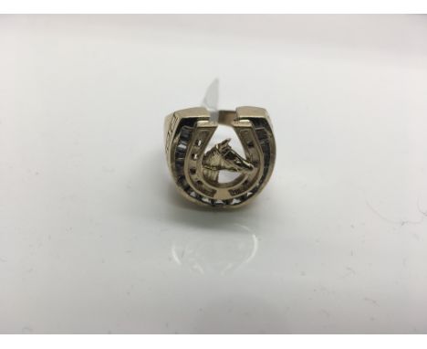 A 9ct stone set horseshoe ring. Weight approx 12.84g Size approx S