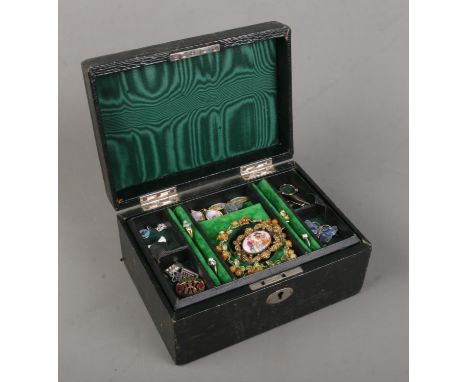 A jewellery box with contents of vintage jewellery. Includes silver and enamel examples, paste set rings, painted brooch etc.