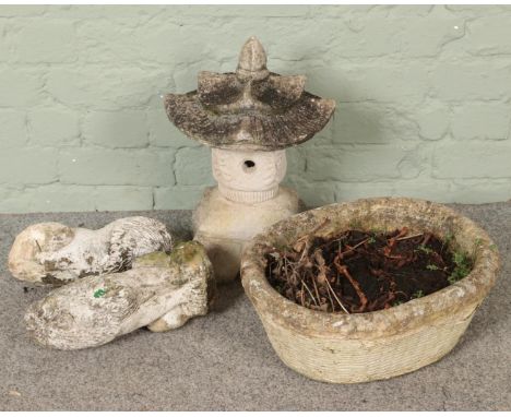 A concrete planter along with three concrete garden ornaments. Includes two lion example, etc.  