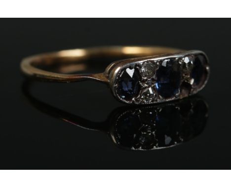 An art deco seven stone diamond and sapphire ring, on yellow metal band. Size M. Total weight: 1.3g  One diamond stone missin