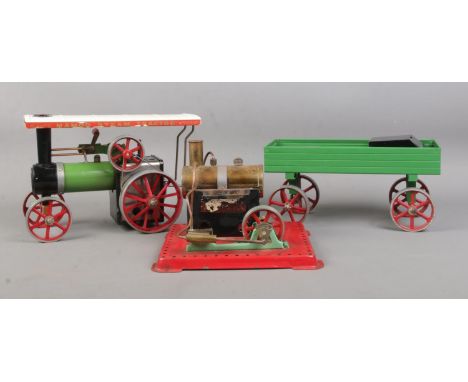A Mamod Steam Tractor, with cart and additional Mamod Stationary Engine.  Chimney missing from Tractor.