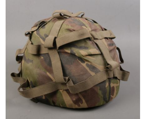 A modern military camouflaged helmet.  