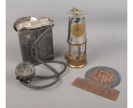 A Protector Lamp and Lighting Co. Type GR6S miners lamp along with BC CAP Lamp Type 1 helmet lamp. Also include replica Sun A