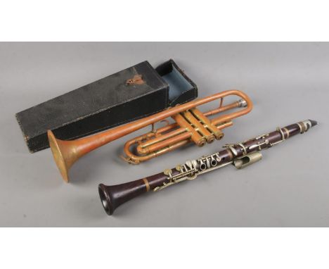 A Boosey &amp; Co. London two piece clarinet in case, together with a Hors Concours Couesnon and Cie trumpet, for repair.  