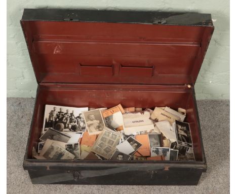 A tin trunk of vintage monochrome photographs. Includes some military examples, etc.  