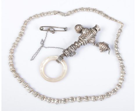 A silver teether/whistle along with an Italian silver teddy bear link necklace. Necklace weight 16.4g.  Teether/whistle beari