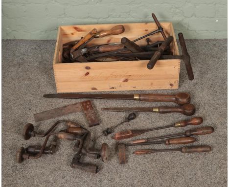 A collection of mostly vintage hand tools to include Moore and Wright copper soldering irons, Archimedes drill, cast iron log