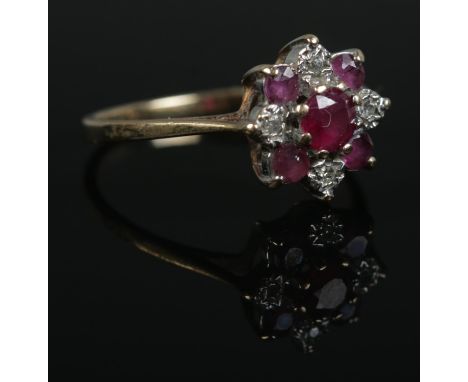 A 9ct Gold ruby and cluster ring. Size N. Total weight: 1.8g  