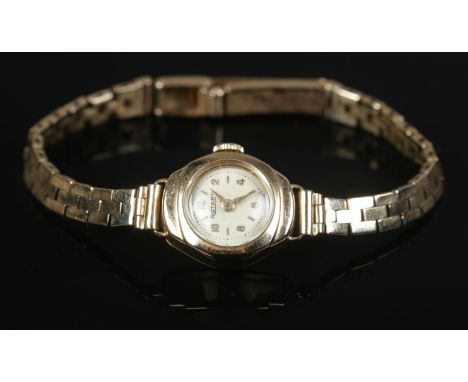 A ladies 9ct Gold Rotary manual wind wristwatch, with both the case and strap stamped '375'. 15 jewel Swiss movement. Weight 