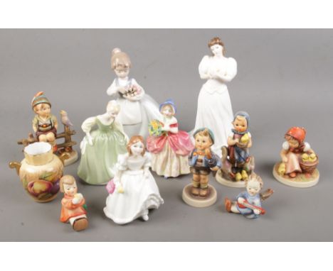 A quantity of ceramic figures. Includes Royal Doulton ladies, Goebel, Nao, etc.  