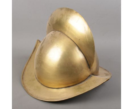 A Spanish Morion style brass helmet.  