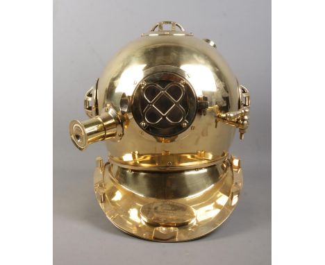 A reproduction US Navy diving helmet; Mark V, with plaque for Morse Diving Equipment Co. Boston M.A..  
