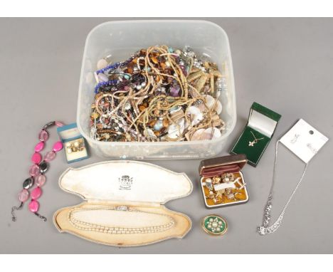 A box of costume jewellery. Includes boxed simulated pearl necklace, beads, earrings, cuff links, etc.  