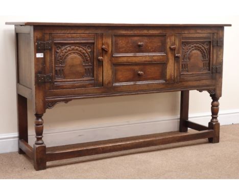 Jacobean style oak sideboard, two carved panel doors flanking two drawers, turned supports joined by stretchers, W146cm, H84c