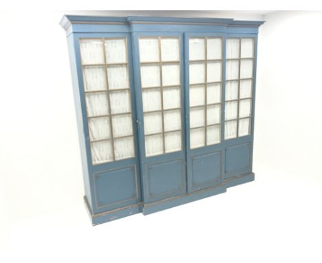 Large early 20th century breakfront four door wardrobe, projecting cornice, light royal blue and gilt painted finish, glazed 