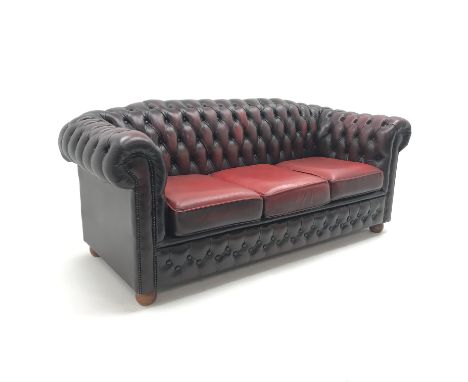 Three seat Chesterfield sofa, upholstered in deep buttoned oxblood leather, W194cm Condition Report Click here for further im