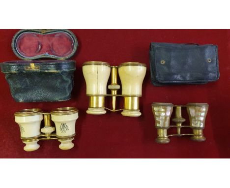 A Victorian pair of ivory and brass Opera glasses, un-named, monogrammed, another pair (one side cracked) and a mother of pea