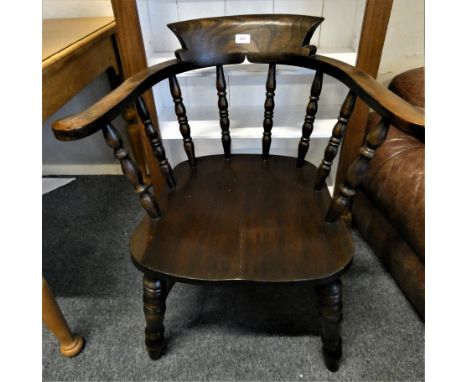 An oak smokers bow armchair. 