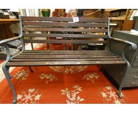 A cast iron and wood garden bench. 