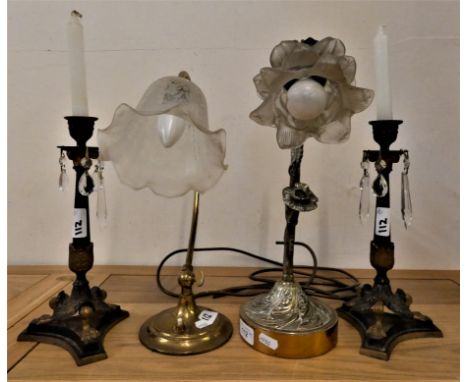 A pair of metal and gilt candlesticks with glass drops, a tubular brass desk lamp with glass shade and a brass table lamp (4)