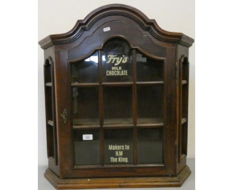 An oak glazed two shelf cabinet, with Frys Milk Chocolate, makers to HM the King painted decal, 67 x 17 x 70 cm. 