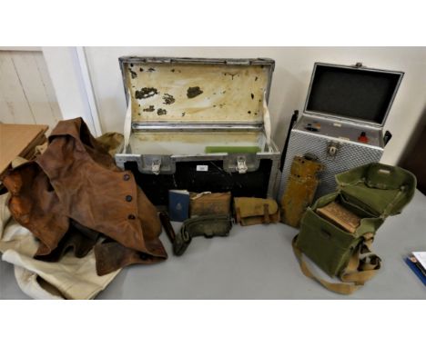 A military metal chest and contents, to include a leather and wool waistcoat, a canvas sheet stamped Strausse and Sons, 1942,