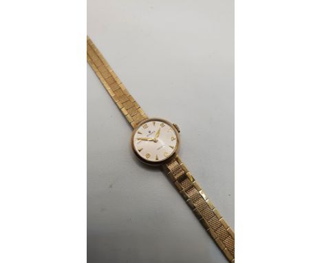 Rolex, a 9ct gold manual wind ladies wristwatch, with integral bracelet, 20 gms, case.