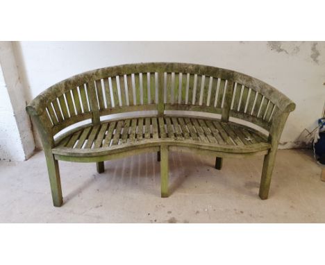 A hardwood garden suite, composed of bench, two arm chairs and a table (4). 
