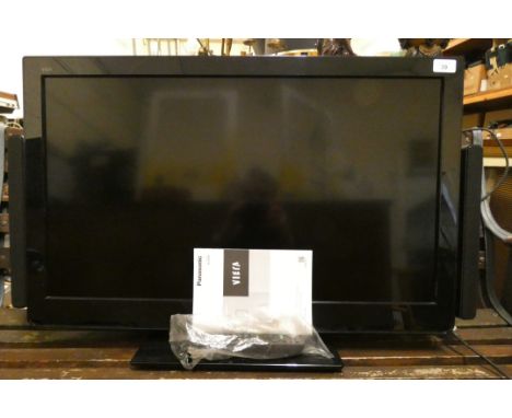 A Panasonic TX-L32E30B television with external speaker system, hand set. 