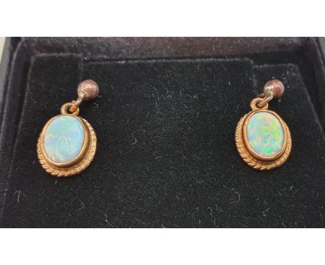 A pair of 9ct gold and opal ear rings. 