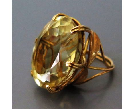 A Large Citrine Dress Ring in yellow metal setting