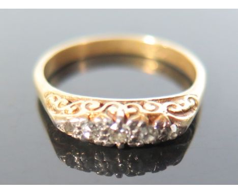 An 18 ct Gold Five Stone Diamond Ring, size M.5, 3.4 g