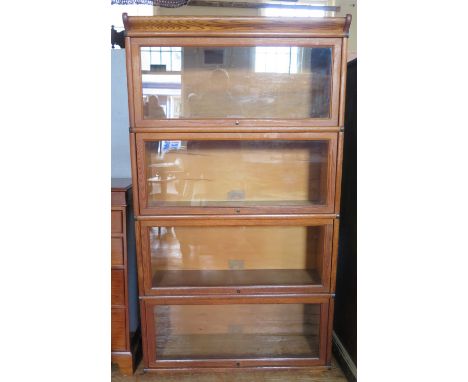 A Globe-Wernicke Light Oak Four Tier Sectional Bookcase